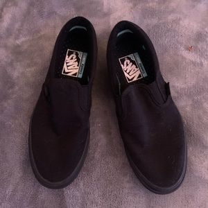 Brand new solid black slip on vans.